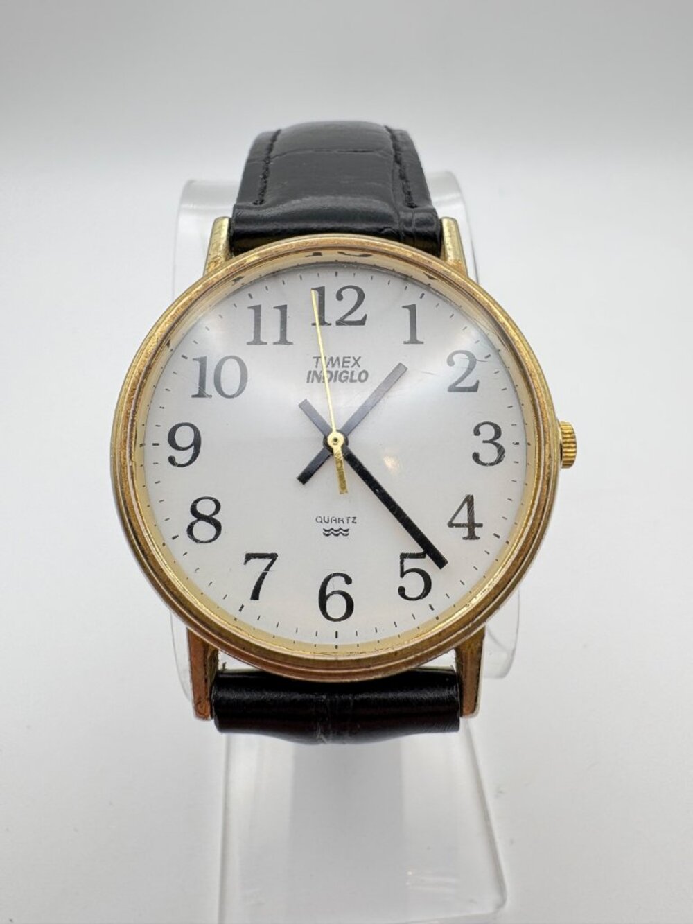 Timex Indiglo Quartz Watch Gold Tone Case White Dial Black Leather Strap 34.3mm